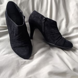 Crisscross black booties in faux suede